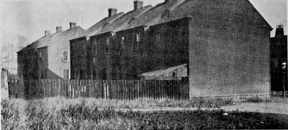 Wooden Shacks Used as Living and Sleeping Quarters in a
Railroad Camp.