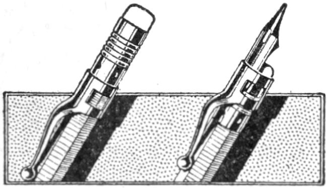 Pen inserted in clip at top of pencil